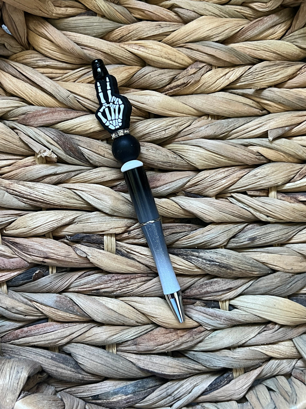 Skeleton hand peace sign pen