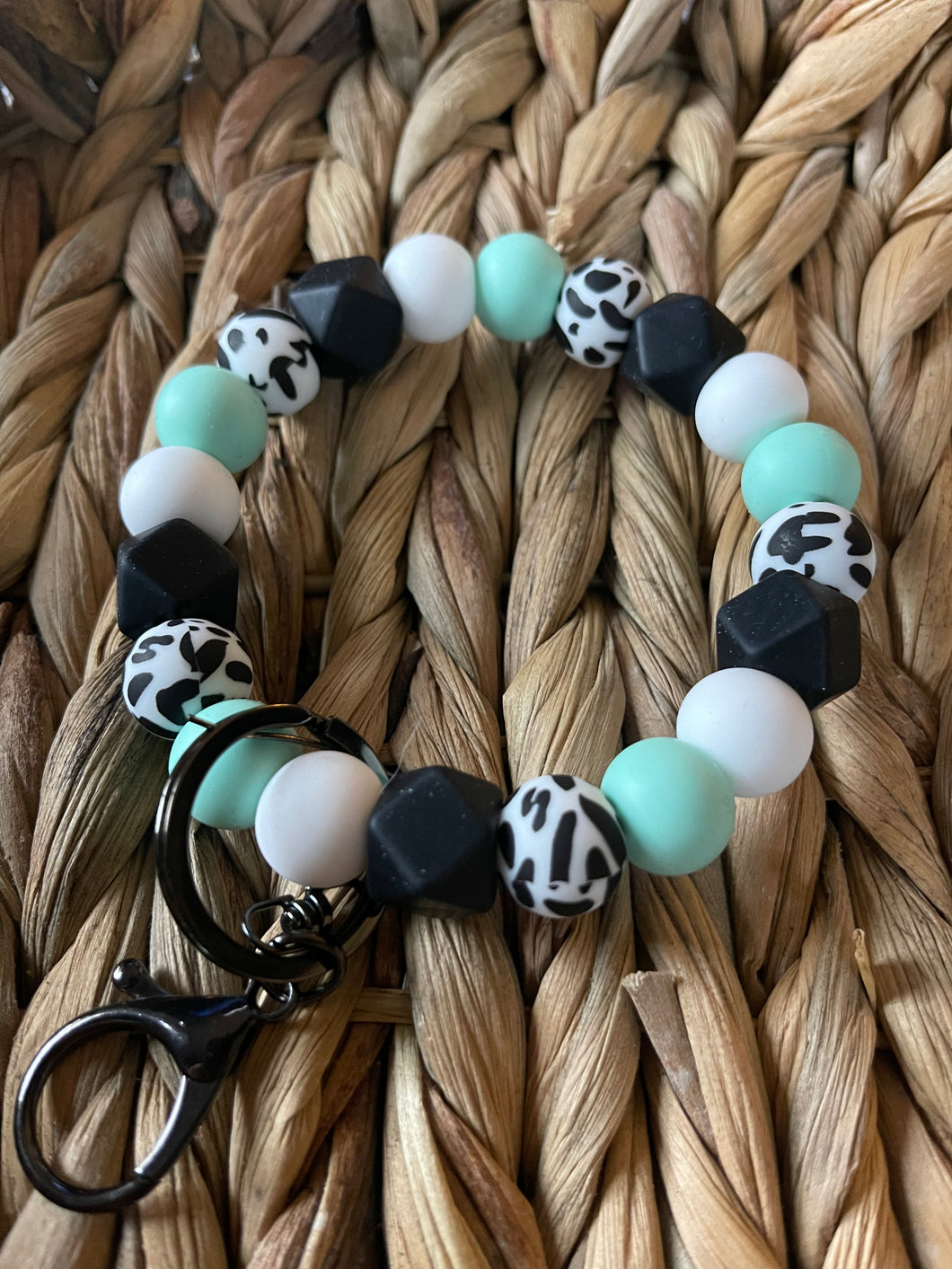 Teal and cow wristlet