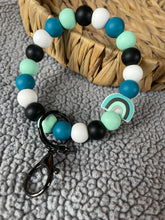 Load image into Gallery viewer, Teal rainbow wristlet
