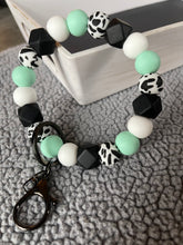 Load image into Gallery viewer, Teal and cow wristlet
